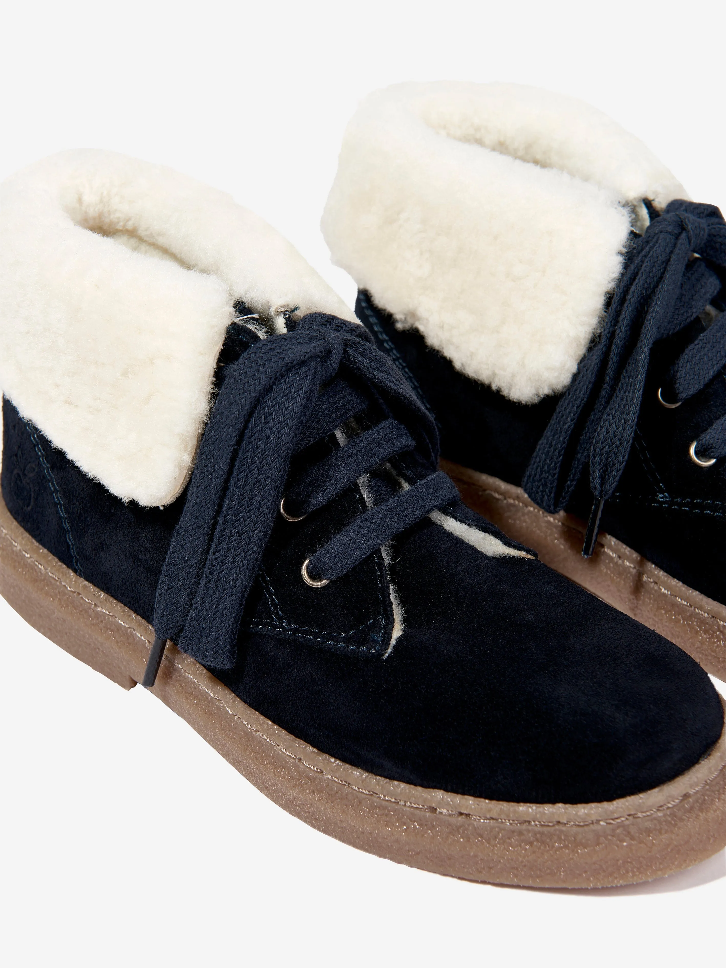 Bottes en fourrure Trix en peau de mouton Pom D'Api Kids en bleu marine